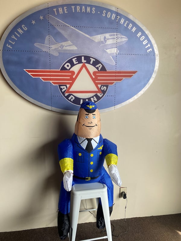 The Hangar in Hapeville is decorated with airline memorabilia, a nod to owner Beau Neal's occupation as a pilot. (Bob Townsend for The Atlanta Journal-Constitution)