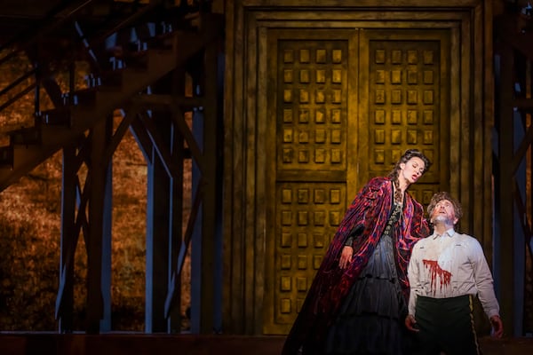 Sara Gartland as Lady Macbeth and Michael Mayes as Macbeth. The Atlanta Opera production plays some violence out on center stage that is typically performed offstage.