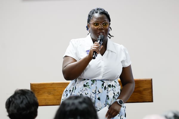 Alaina Reaves talks to Clayton County residents during a forum organized by Women of Clayton County at Harvest Baptist Tabernacle Church on Thursday, June 6. Reaves is running for District 1 Commissioner for the Clayton County Commission. (Miguel Martinez / AJC)