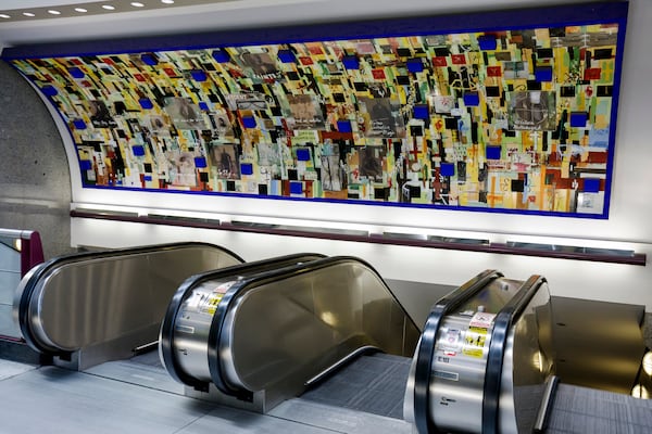 
                        Radcliffe Bailey’s mural “Saints,” a 40-foot-long collage blending blocks of color with old photos of dead relatives, on display at Hartsfield-Jackson Atlanta International Airport. Bailey, a Georgia-based artist whose collage paintings and sculptural assemblages incorporated family tintypes, African figurines, disassembled piano keys and other objects in an exploration of both his personal history and the broader sorrows and joys of the Black experience, died on Nov. 14, 2023, at his home in Atlanta. He was 54. (via the artist and Jack Shainman Gallery, New York via The New York Times) -- NO SALES; FOR EDITORIAL USE ONLY WITH NYT STORY SLUGGED OBIT BAILEY BY ALEX WILLIAMS FOR NOV. 20, 2023. ALL OTHER USE PROHIBITED. --
                      