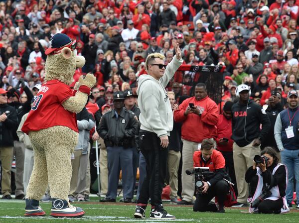 Braves outfielder Joc Pederson and mascot Blooper are cheered by Georgia fans during a NCAA football game at Sanford Stadium in Athens on Saturday, November 6, 2021. Georgia won 43-6 over Missouri. (Hyosub Shin / Hyosub.Shin@ajc.com)