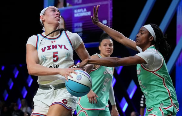 FILE - Vinyl forward Dearica Hamby (5) goes to the basket as Laces guard Tiffany Hayes, right, defends during the second half of an Unrivaled 3-on-3 basketball game Friday, Jan. 24, 2025, in Medley, Fla. (AP Photo/Lynne Sladky, File)