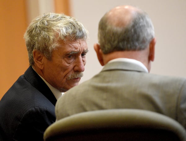 Defendant Bradley Asbury, left, accused of holding down a teenage boy so colleagues could rape him at a New Hampshire youth center in the 1990s, confers with his attorney David Rothstein during opening statements for his trial at Hillsborough County Superior Court in Manchester, N.H.,, Tuesday, Nov. 19, 2024. (David Lane/Union Leader via AP, Pool)