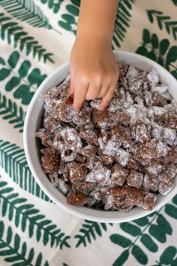 Salty mix-ins, such as pretzels and potato chips, help make Sweet and Savory Puppy Chow enjoyable for adults as well as children. (Kate Williams for The Atlanta Journal-Constitution)