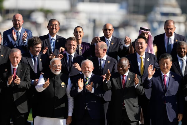 Leaders attending the G20 Summit pose for a group photo in Rio de Janeiro, Monday, Nov. 18, 2024. (AP Photo/Eraldo Peres)