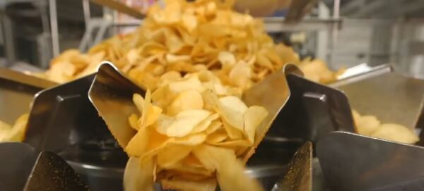 Symphony Potato Chips on the production line ready to be coated in a spice mixture
(Courtesy of EPI Media)