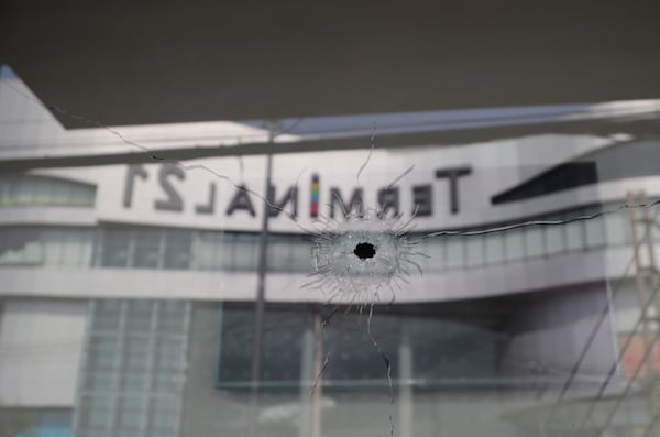 Bullet holes are shown at the Terminal 21 Korat mall in Nakhon Ratchasima, Thailand.