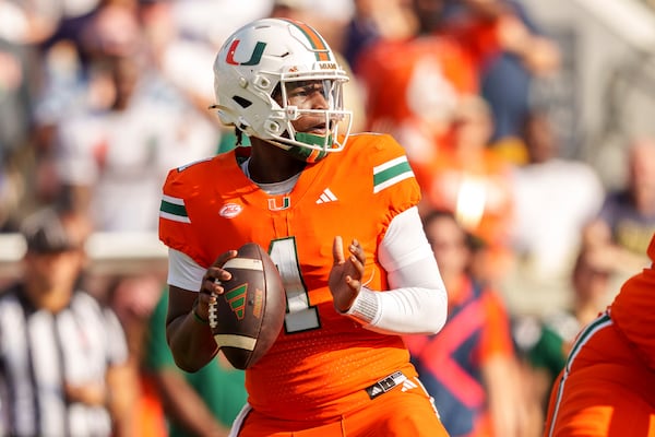 Miami quarterback Cam Ward (1) looks for an open receiver during the second half of an NCAA college football game against Georgia Tech, Saturday, Nov. 9, 2024, in Atlanta. (AP Photo/Jason Allen)