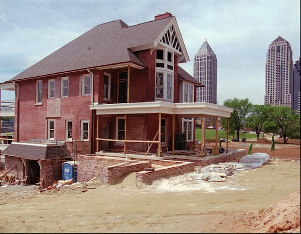 Restoration work on the Margaret Mitchell House continues Wednesday, April 24, 1996 near downtown Atlanta. The building, nearly destroyed by fire in 1994, is where author Margaret Mitchell wrote 'Gone With The Wind.' Daimler-Benz, Germany's largest industrial group, is restoring the property and plans to make it their centerpiece for the 1996 Summer Olympics. (AP Photo/Tannen Maury)