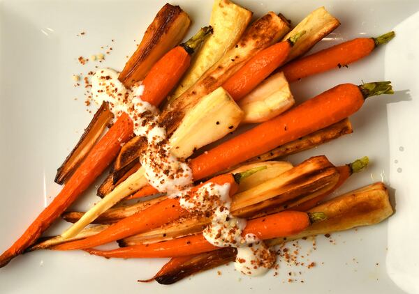 Roasted Parsnips and Carrots with Horseradish Cream. Styling by Jennifer Hill Booker. (CHRIS HUNT FOR THE ATLANTA JOURNAL-CONSTITUTION)