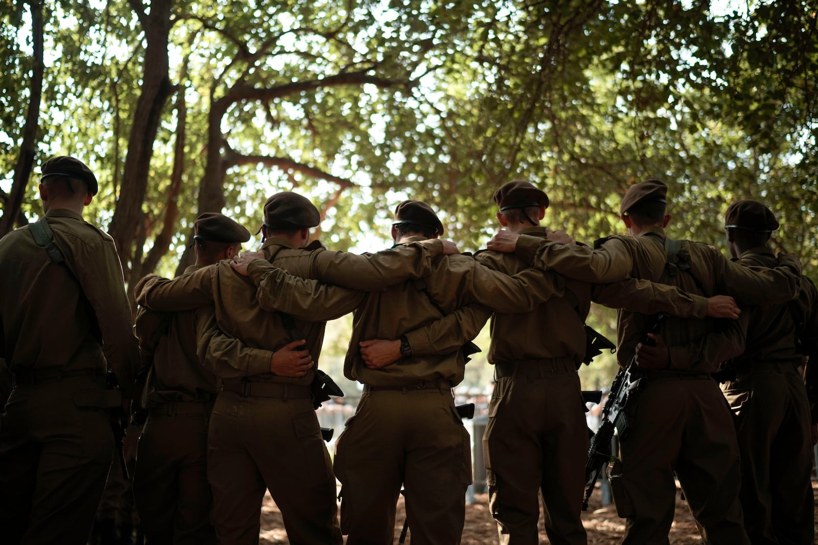 Israeli soldiers mourn Sgt. Amitai Alon, killed Sunday by a Hezbollah drone attack that wounded dozens and killed four soldiers, during his funeral near Ramot Naftali, Israel, Monday, Oct. 14, 2024. (AP Photo/Leo Correa)