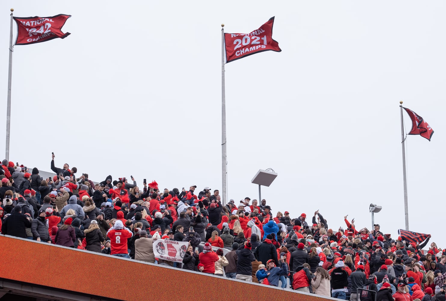 220115-Athens-The 2021 National Championship flag flies for the first time over Sanford Stadium at the end of the National Championship celebration Saturday afternoon, Jan. 15, 2022, in Athens. Ben Gray for the Atlanta Journal-Constitution