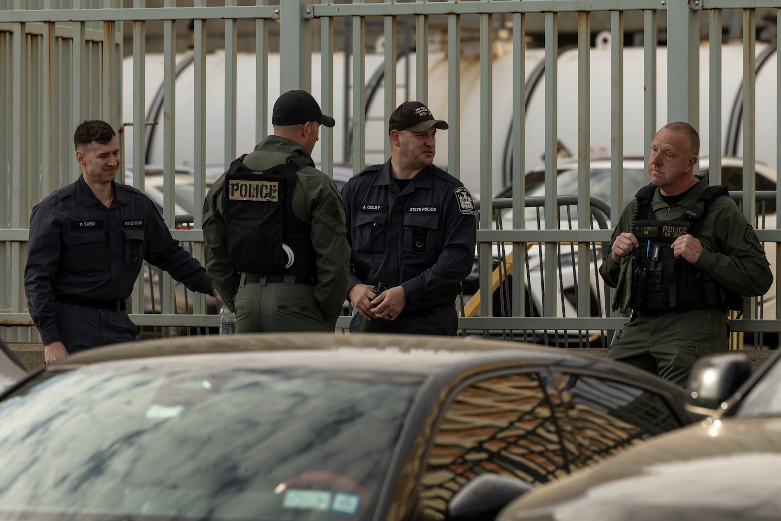 Federal enforcement officers stand outside the Metropolitan Detention Center during an interagency operation, Monday, Oct. 28, 2024, in the Brooklyn Borough of New York. (AP Photo/Yuki Iwamura)