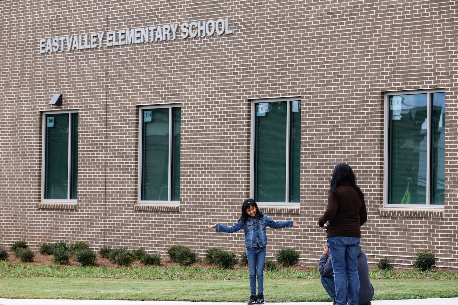 Ariana Rahut, 9, a fourth grade student at Eastvalley Elementary School in Marietta, poses in front of the new school on Monday, Oct. 16, 2023. (Natrice Miller/ Natrice.miller@ajc.com)