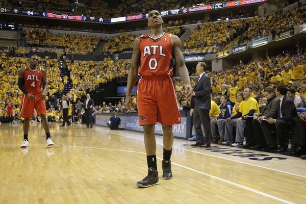 Jeff Teague checks the Game 7 score. Doesn't like what he sees. (AJ Mast/AP)