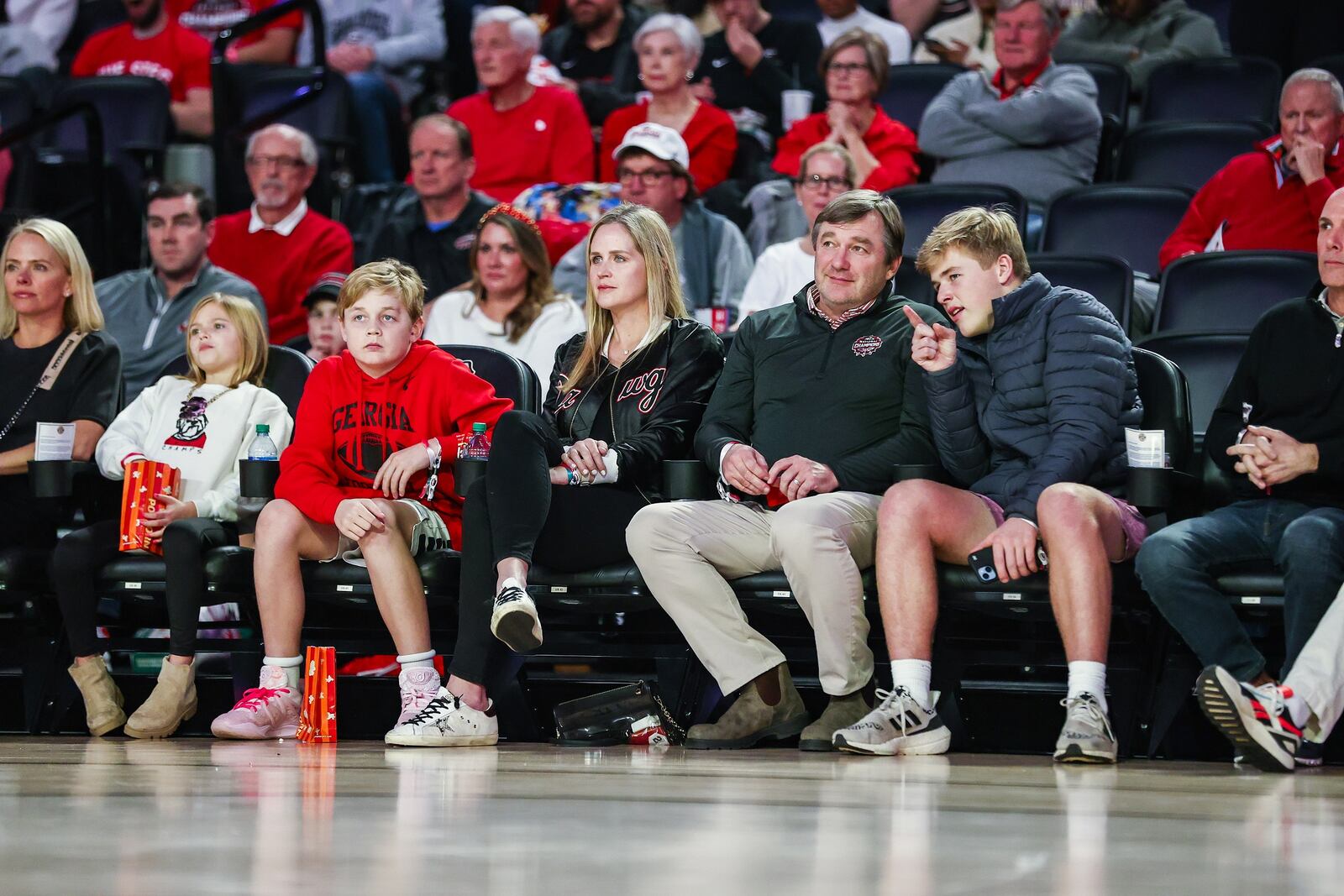 Georgia football coach Kirby Smart and his family watch a basketball game against Mississippi State at Stegeman Coliseum in Athens, Ga., on Wednesday, Jan. 11, 2023. (Photo by Tony Walsh / UGA Athletics)