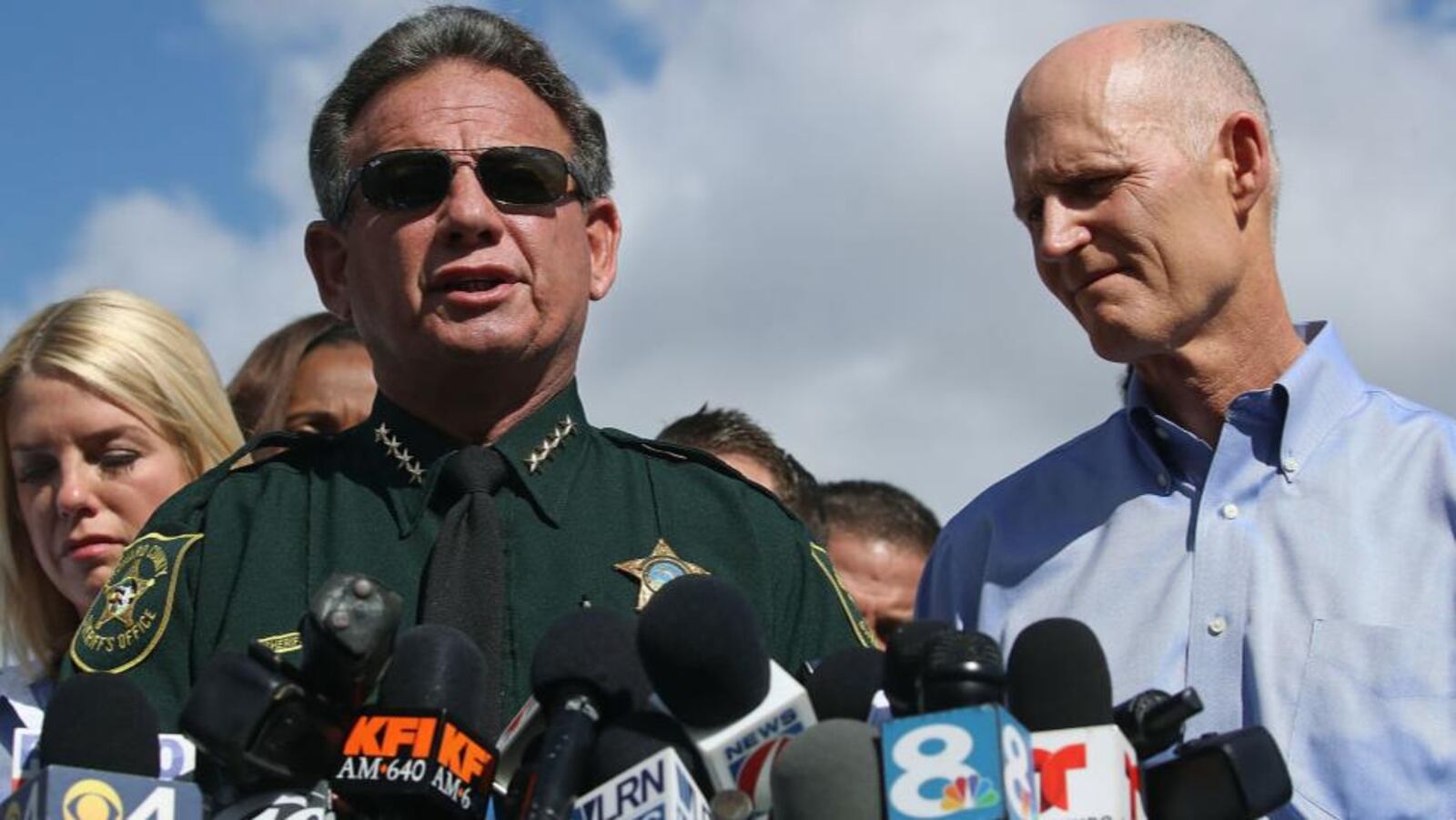 Broward County Sheriff Scott Israel speaks at a news conference, flanked by Florida Gov. Rick Scott, right, and state Attorney General Pam Bondi.