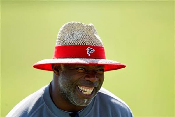 Atlanta Falcons secondary coach Tim Lewis jokes around with players during an NFL football practice, Friday, June 14, 2013, in Flowery Branch, Ga. (AP Photo/Jaime Henry-White) Atlanta Falcons secondary coach Tim Lewis jokes around with players during an NFL football practice, Friday, June 14, 2013, in Flowery Branch, Ga. (AP Photo/Jaime Henry-White)