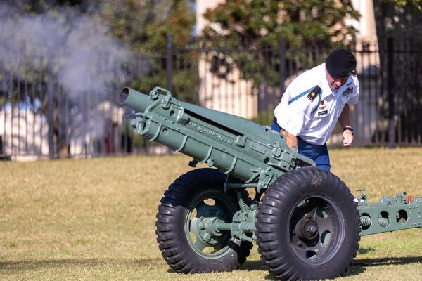 Retired U.S. Army Maj. Ben Carrick fires Georgia Military College’s howitzer at the campus in Milledgeville Monday as part of a commemoration of the 22nd anniversary of the Sept. 11 terrorist attacks. (Arvin Temkar / arvin.temkar@ajc.com)