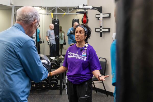 Nausheen Quraishy, a Rock Steady Boxing Instructor, runs a class in which people with Parkinson's disease exercise and try to regain their strength at Wellstar Health Place at Kennestone Hospital. PHIL SKINNER FOR THE ATLANTA JOURNAL-CONSTITUTION