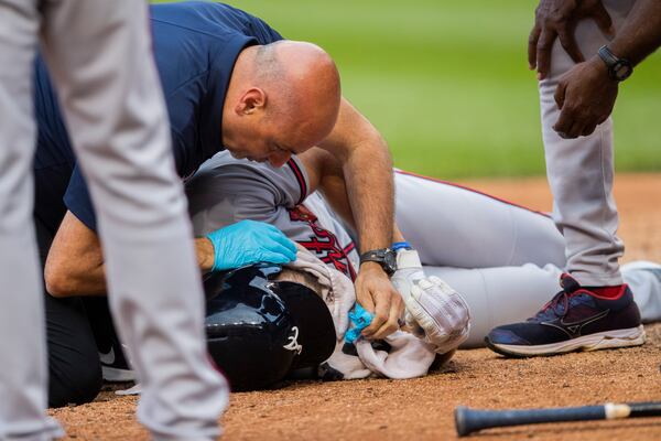 Braves' Charlie Culberson is on the ground after getting hit by a ball during the seventh inning Saturday, Sept. 14, 2019, against the Washington Nationals in Washington, D.C.