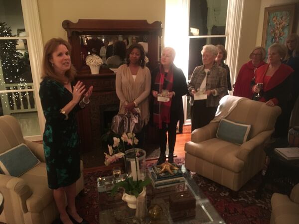  Leslie Anne Tarabella, left, regales fans at a recent book signing event in Marietta.  