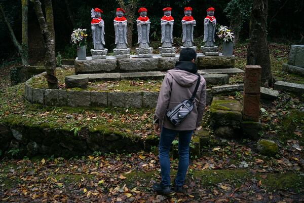 Stone statues are placed near the site of former Fourth Souai Dormitory for the mine workers from the Korean Peninsula, in Sado, Niigata prefecture, Japan, Sunday, Nov. 24, 2024. (AP Photo/Eugene Hoshiko)