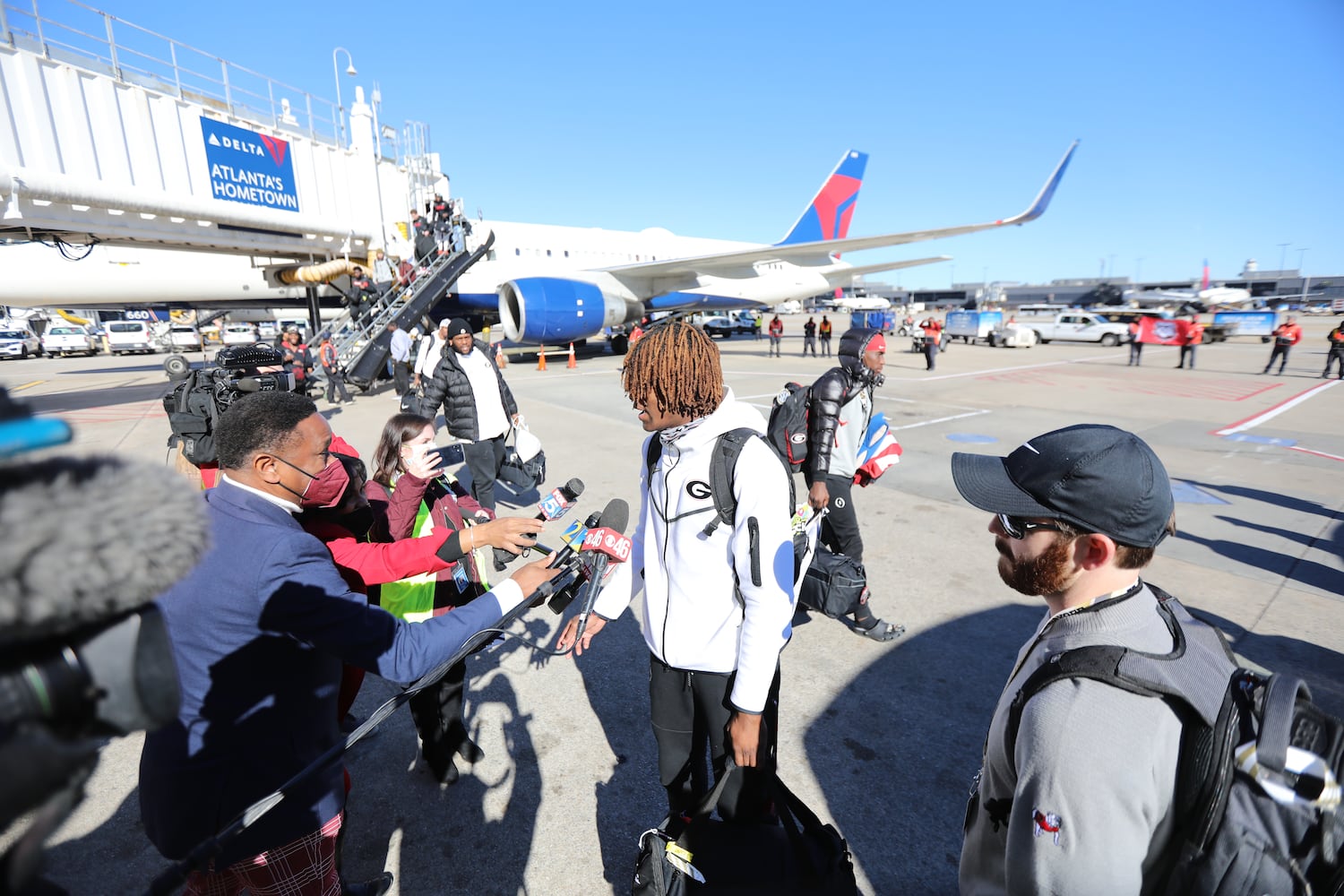 Georgia defensive back Lewis Cine spoke to the press at Hartsfield-Jackson Atlanta International. Miguel Martinez for The Atlanta Journal-Constitution