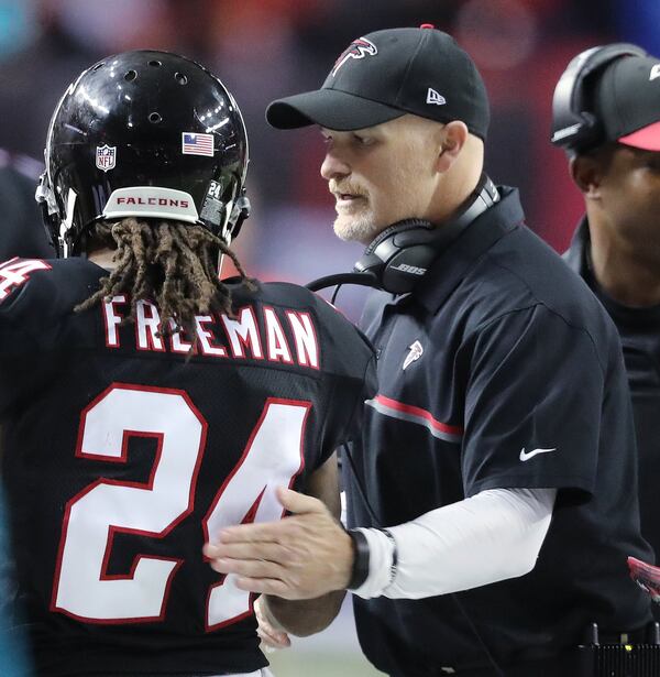 December 18, 2016, ATLANTA: Falcons running back Devonta Freeman gets a pat on the back from head coach Dan Quinn after his second touchdown against the 49ers during the second quarter in an NFL football game on Sunday, Dec. 18, 2016, in Atlanta. Freeman scored three touchdowns in the game. Curtis Compton/ccompton@ajc.com