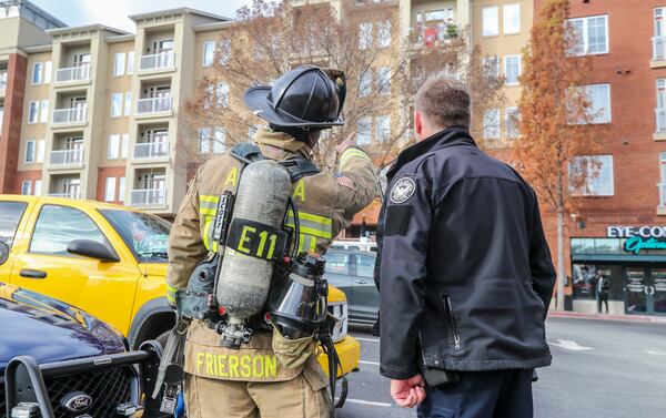 Atlanta Fire Rescue called in Atlanta police after responding to a small trash fire at the apartment complex. JOHN SPINK / JSPINK@AJC.COM