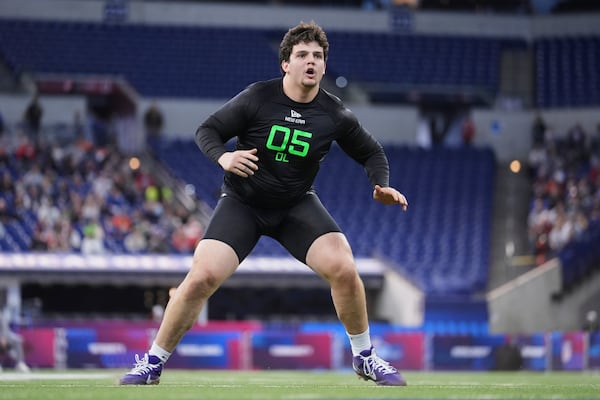 LSU offensive lineman Will Campbell runs a drill at the NFL football scouting combine in Indianapolis, Sunday, March 2, 2025. (AP Photo/Michael Conroy)