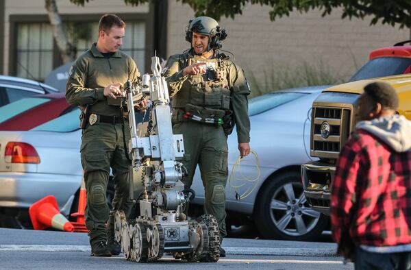 SWAT officers were deployed to a Gwinnett County apartment Thursday morning after a man barricaded himself inside one of the units. JOHN SPINK / JSPINK@AJC.COM