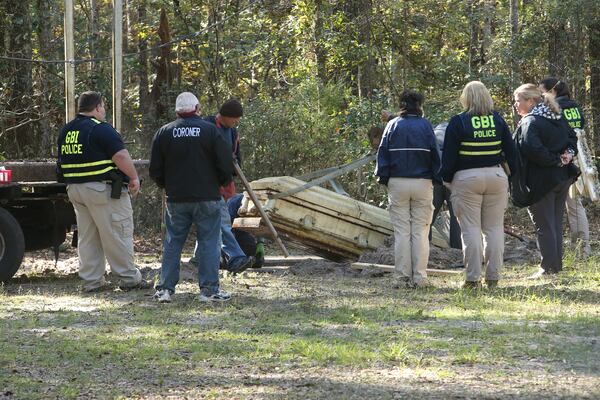 11/18/2020 - Spring Bluff, Georgia: The GBI exhumes the body of Harold Swain, who was murdered inside Rising Daughter Baptist Church along with his wife Thelma. (Tyson Horne / Tyson.Horne@ajc.com)