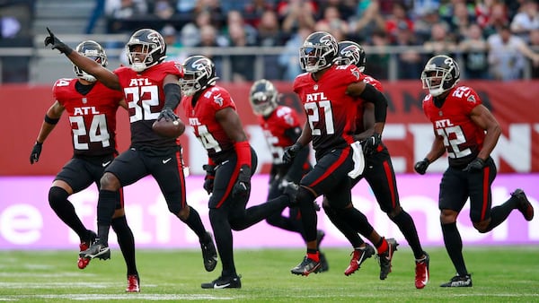 Falcons safety Jaylinn Hawkins (32) celebrates making an interception during the first half  against the New York Jets Sunday, Oct. 10, 2021, at the Tottenham Hotspur stadium in London, England. (Ian Walton/AP)