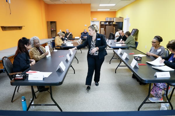 Spalding County Elections Supervisor Kim Slaughter helps poll workers during a hand count of ballots Thursday. Hand counts were also planned in Bartow, Floyd, Forsyth, Paulding and Polk counties. Miguel Martinez /miguel.martinezjimenez@ajc.com