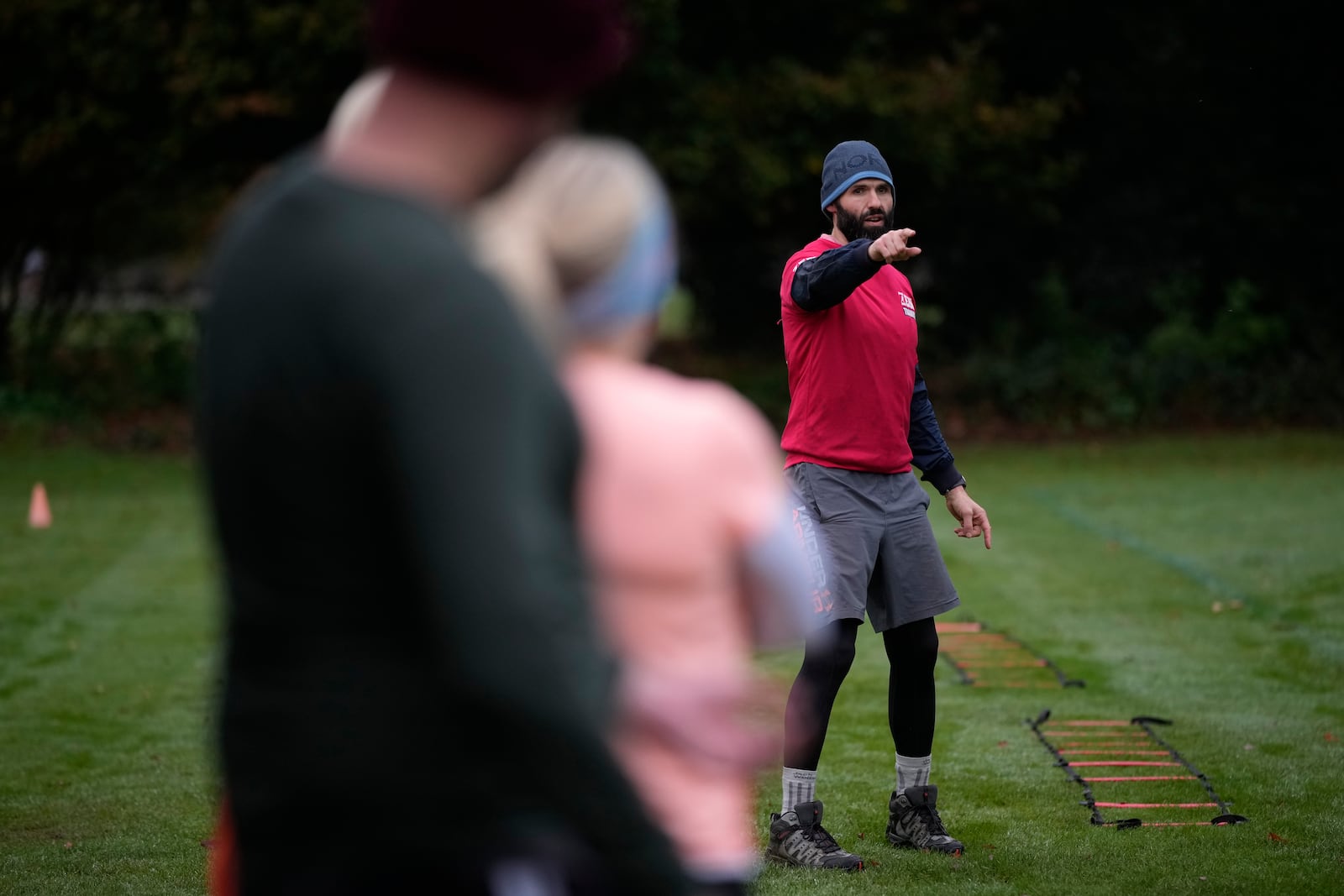 Personal fitness trainer Richard Lamb, leads a group in an outdoor gym class in London, Saturday, Oct. 26, 2024. Lamb works for Alan Ezen, and his company Zen Training. (AP Photo/Alastair Grant)