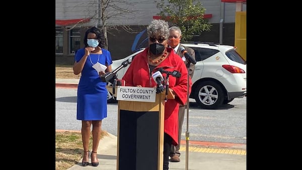 Fulton County resident Valerie Lewis, 70, dressed in red, received a COVID-19 vaccine shot and at a Wednesday news conference encouraged other African Americans to get the shots. She is taking part in an initiative by county officials to get more people in underserved communities vaccinated. ERIC STIRGUS/ESTIRGUS@AJC.COM.