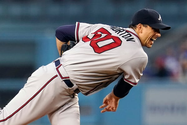 Atlanta Braves starting pitcher Charlie Morton watches a throw during the first inning of the team's baseball game against the Los Angeles Dodgers on Tuesday, Aug. 31, 2021, in Los Angeles. (AP Photo/Marcio Jose Sanchez)