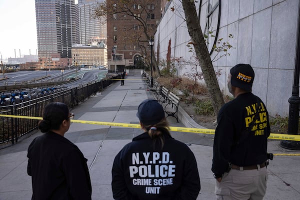 NYPD officers stand at the site of stabbing spree near the United Nations Headquarters, New York, Monday, Nov. 18, 2024. (AP Photo/Yuki Iwamura)