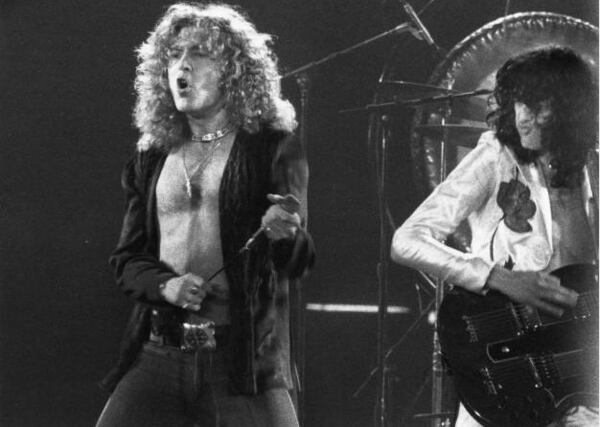 Robert Plant and Jimmy Page of Led Zeppelin perform live in Atlanta in May 1977. AJC file photo: Rick Diamond