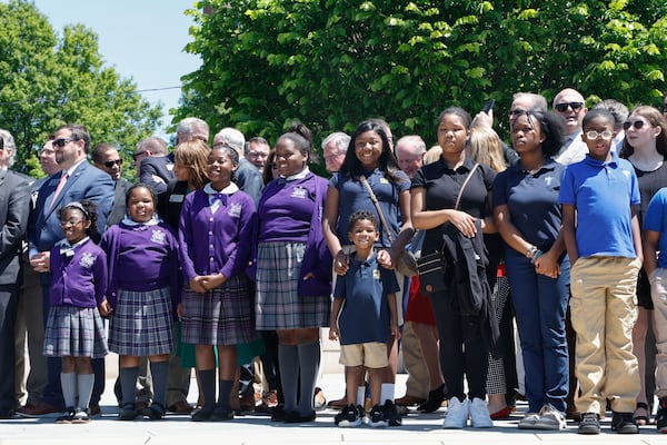 Students and supporters wait for Gov. Brian Kemp to arrive to sign Senate Bill 233, known as the Georgia Promise Scholarship Act, at Liberty Plaza on Tuesday, April 23, 2024. (Natrice Miller/AJC)