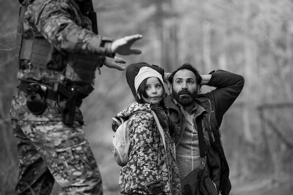 Talia Ajjan (center) and Jalal Altawil (right) are featured in Polish director Agnieszka Holland's film "Green Border." Courtesy of Aqata Kubis