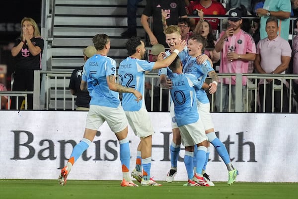 New York City FC players celebrate a goal by New York City FC defender Mitja Ilenic, right, during the first half of an MLS soccer match against Inter Miami, Saturday, Feb. 22, 2025, in Fort Lauderdale, Fla. (AP Photo/Rebecca Blackwell)