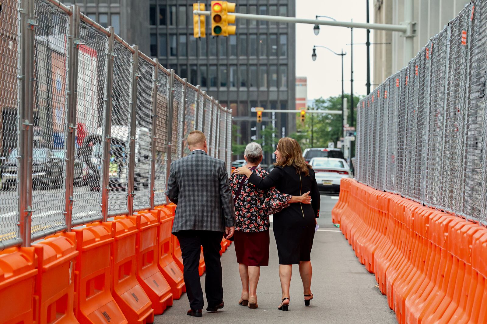 Tina Barton, vice chair of the Committee for Safe and Secure Elections, leaves the federal courthouse in Detroit on Tuesday, July 9, 2024, with her mother and husband. Barton attended the sentencing hearing for Andrew Nickels, an Indiana man who after the 2020 election left a voicemail threatening her life. (Photo by Olivia Talkington/News21)