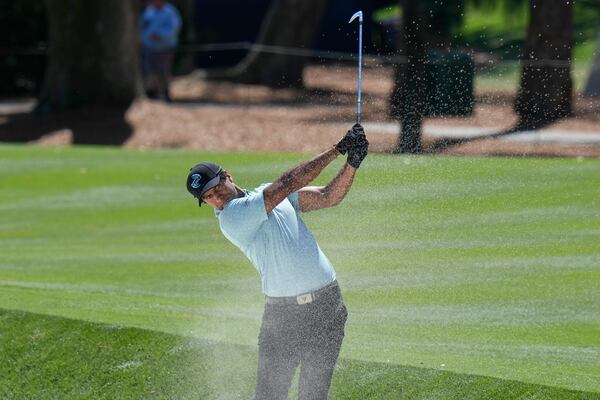 Aaron Rai hits from a fairway bunker on the 15th hole during the first round of The Players Championship golf tournament Thursday, March 13, 2025, in Ponte Vedra Beach, Fla. (AP Photo/Chris O'Meara)