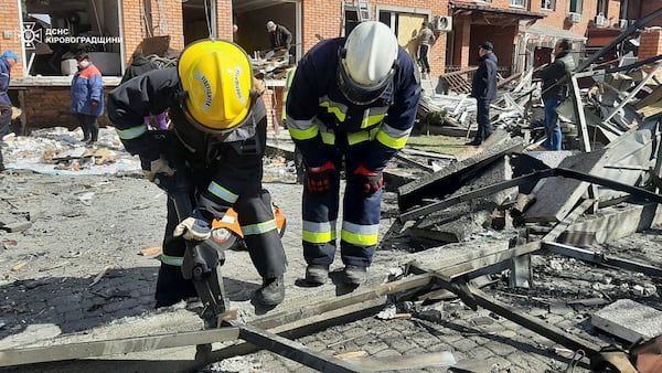 In this photo provided by the Ukrainian Emergency Service, searchers and rescuers clear the rubbles following a Russian drone attack in Kropyvnytskyi, Kirovohrad region, Ukraine, Thursday, March 20, 2025. (Ukrainian Emergency Service via AP)