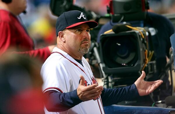 Atlanta Braves manager Fredi Gonzalez (33) argues from the dugout during a baseball game Toronto Blue Jays Wednesday, Sept. 16, 2015, in Atlanta. (AP Photo/John Bazemore)