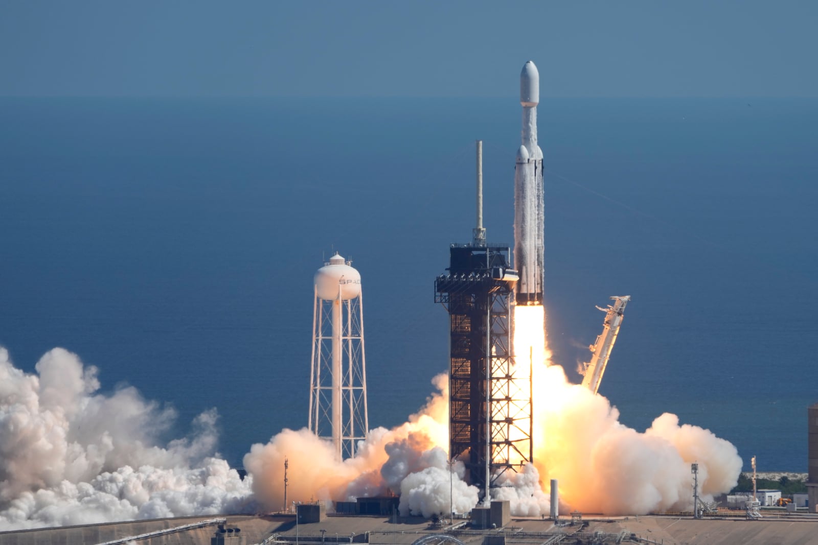 A SpaceX Falcon Heavy rocket with a NASA spacecraft bound for Jupiter lifts off from pad 39A at the Kennedy Space Center Monday, Oct. 14, 2024 in Cape Canaveral, Fla. (AP Photo/John Raoux)