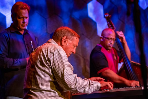 Venkman's in the Fourth Ward is home to Joe Gransden's Jazz Jam every Wednesday where many of Atlanta's jazz greats gather to watch and to participate.  On Wednesday, July 13, 2022, Gransden’s band starts of the show with Geoffrey Haydon on keyboard, front, Craig Shaw on upright base, right, and Joe Gransden on trumpet, left.  (Jenni Girtman for The Atlanta Journal-Constitution)