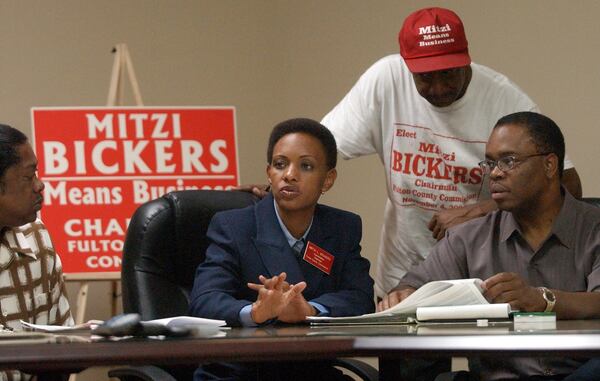 Mitzi Bickers, pictured center in this 2003 file photo from her campaign for Fulton County Commissioner chair, has emerged as a central figure in the bribery and bid-rigging scandal in Atlanta City Hall. The political operative and local pastor is also a political player in Jackson, Miss., where she has attempted to win contracts there after raising money for the mayor. FILE PHOTO